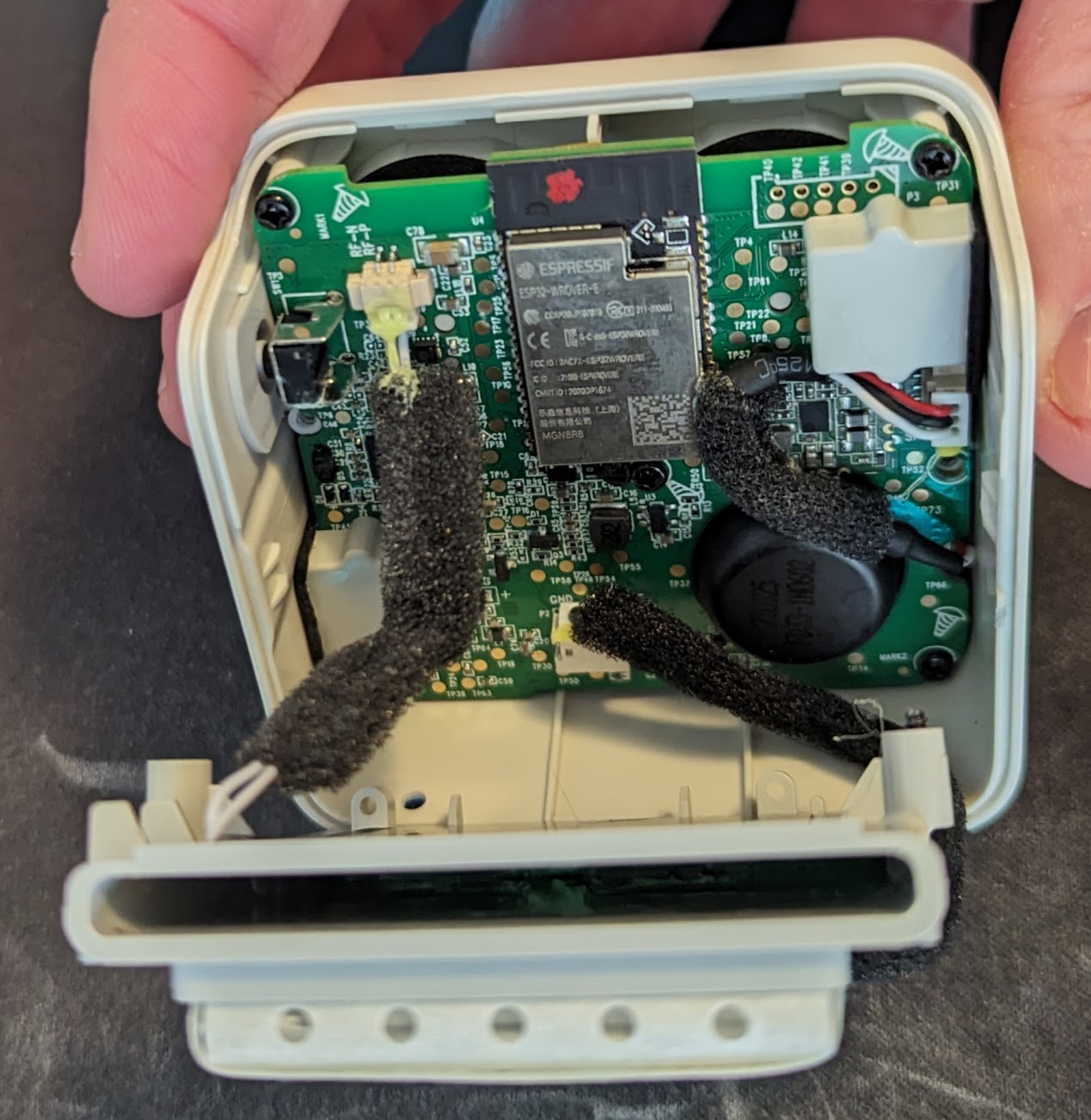 The internals of the yoto mini including the PCB and the cable connecting to the battery and wifi antenna.